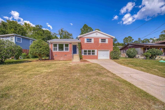 split level home with a front yard and a garage