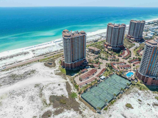birds eye view of property with a beach view, a water view, and a view of city