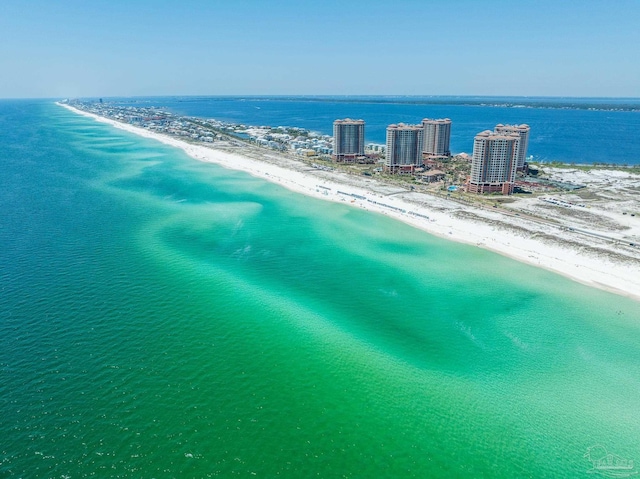 birds eye view of property with a beach view and a water view