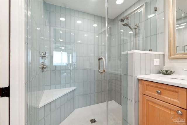 full bath with vanity and a stall shower