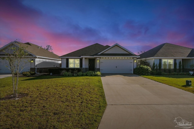 ranch-style house with a lawn and a garage