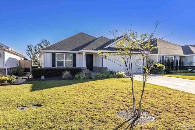 ranch-style home with a garage and a front lawn