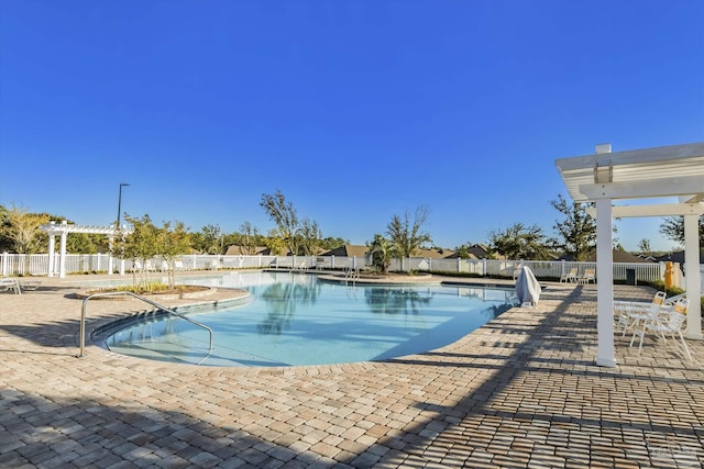 view of pool featuring a pergola and a patio