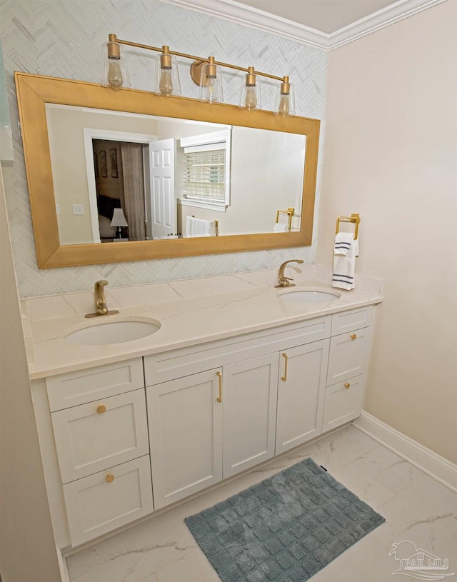 bathroom with baseboards, a sink, and marble finish floor