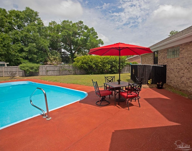 view of swimming pool with a fenced in pool, a fenced backyard, a patio area, and a yard
