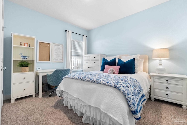 bedroom featuring carpet