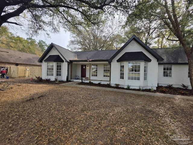 5674 Windsong Dr, Milton, FL 32570 - single story home with a shingled roof