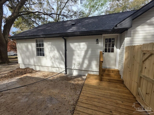 5674 Windsong Dr, Milton, FL 32570 - exterior space with a shingled roof, fence, and entry steps