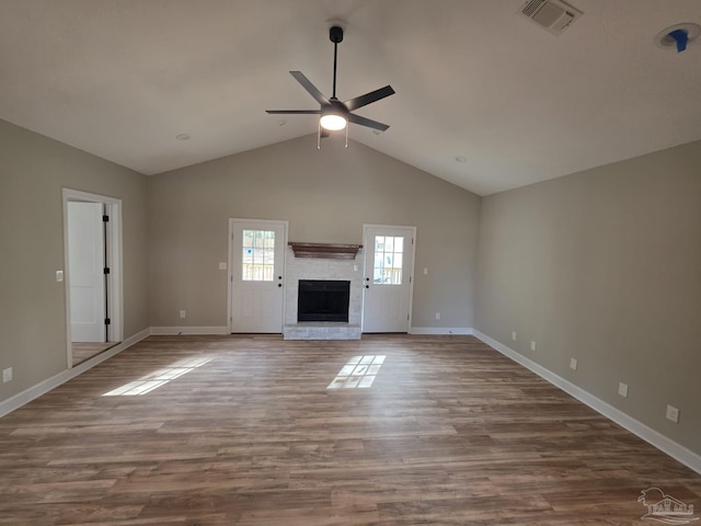 5674 Windsong Dr, Milton, FL 32570 - unfurnished living room featuring a ceiling fan, lofted ceiling, a fireplace, baseboards, and wood finished floors
