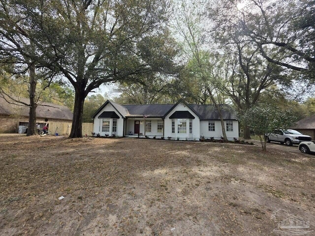 5674 Windsong Dr, Milton, FL 32570 - ranch-style house featuring covered porch