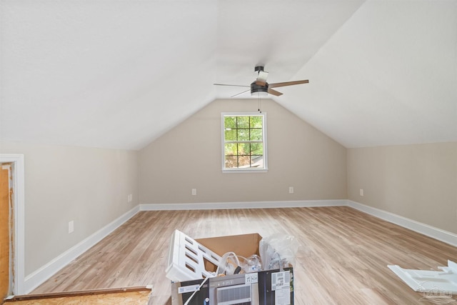 5674 Windsong Dr, Milton, FL 32570 - additional living space with light wood finished floors, a ceiling fan, vaulted ceiling, and baseboards