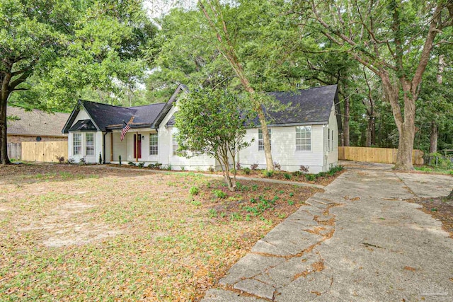 5674 Windsong Dr, Milton, FL 32570 - ranch-style home featuring fence and roof with shingles