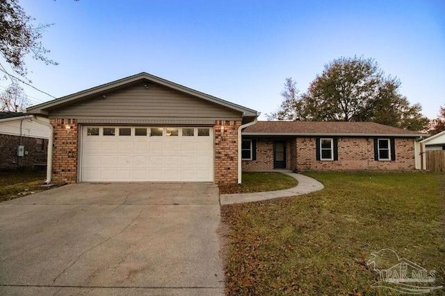 ranch-style house with a front yard and a garage