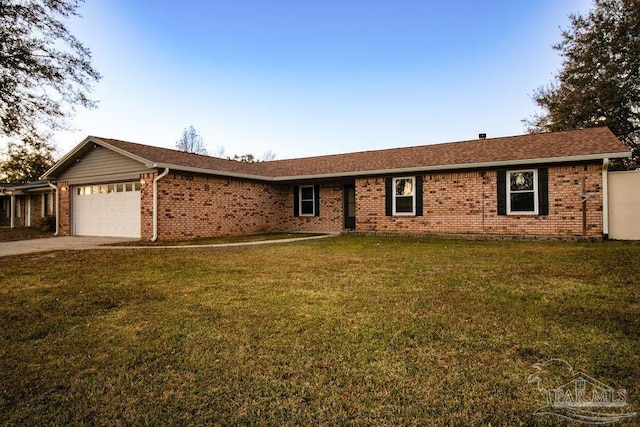 ranch-style house with a garage and a front yard