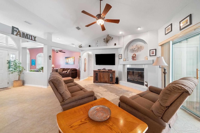 living room featuring light tile patterned floors, ceiling fan, and high vaulted ceiling