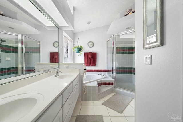 bathroom with independent shower and bath, dual vanity, a textured ceiling, and tile patterned flooring