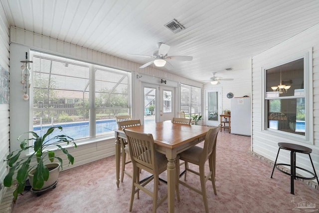 sunroom featuring french doors and ceiling fan