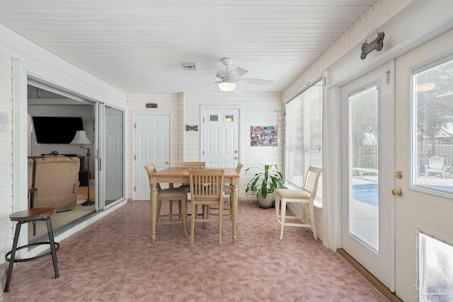 sunroom / solarium with plenty of natural light and ceiling fan