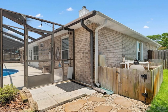 view of side of property featuring a patio