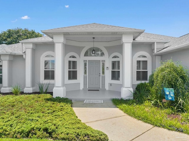 property entrance featuring covered porch