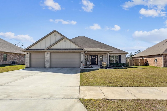 view of front of house with a garage, a front lawn, concrete driveway, and brick siding