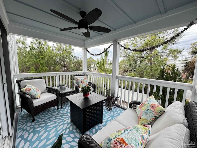 wooden terrace featuring an outdoor hangout area and ceiling fan