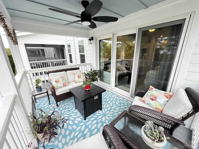 exterior space featuring ceiling fan