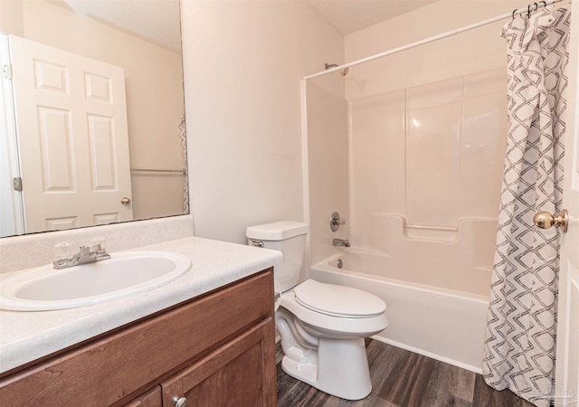 full bathroom featuring wood finished floors, toilet, vanity, and shower / bath combo