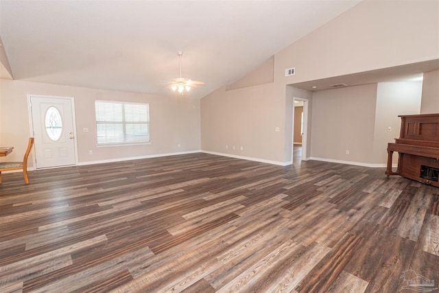 unfurnished living room featuring a ceiling fan, dark wood-type flooring, vaulted ceiling, and baseboards