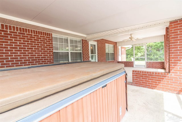 wooden deck featuring a ceiling fan