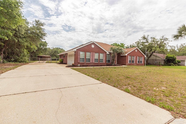 ranch-style home with brick siding and concrete driveway