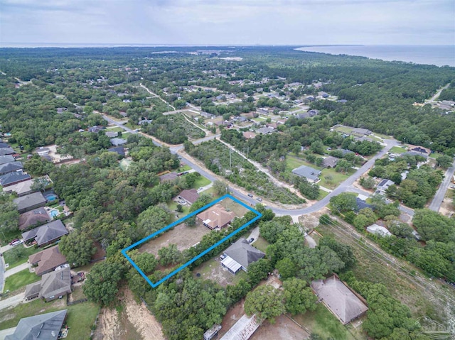 aerial overview of property's location featuring property boundaries highlighted and a forest