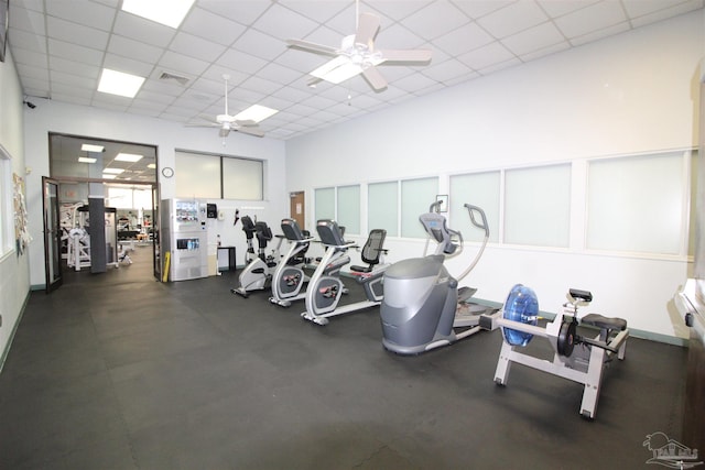 workout area with a drop ceiling and a ceiling fan