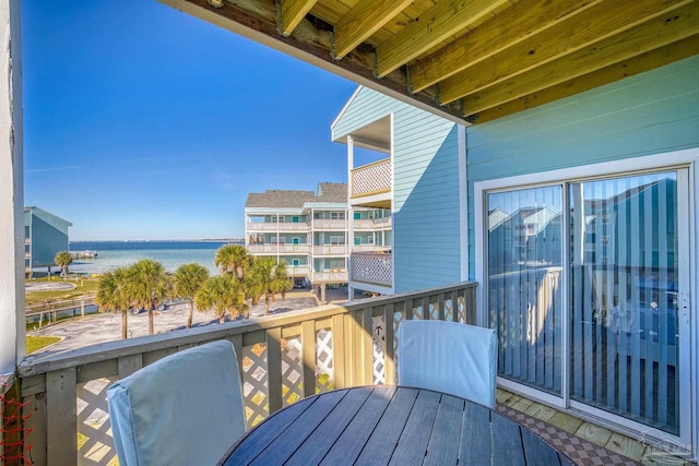 balcony featuring a water view