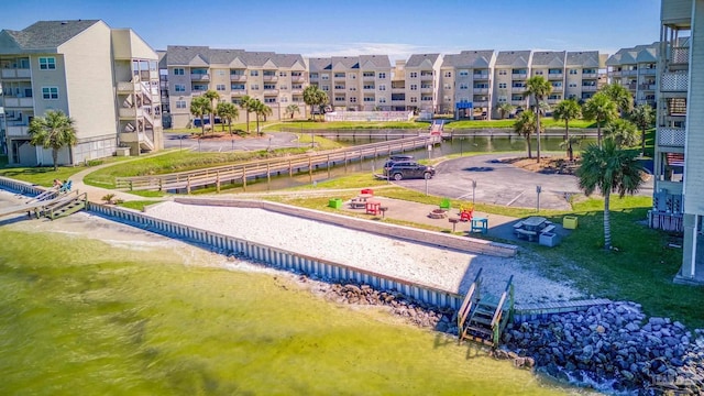 view of home's community with a water view