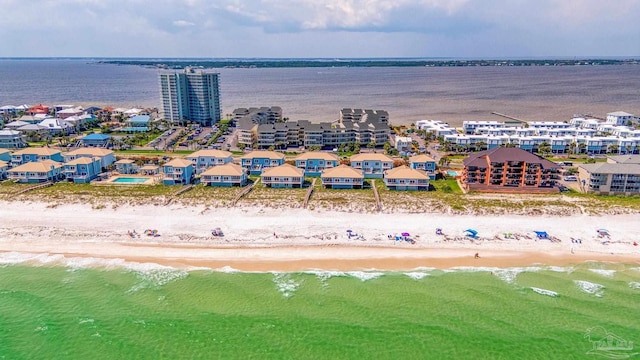 drone / aerial view with a water view and a view of the beach