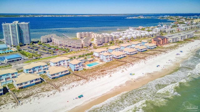 drone / aerial view with a beach view and a water view