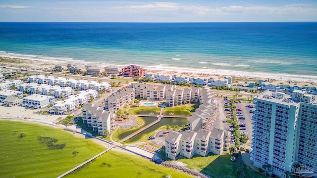 drone / aerial view with a beach view and a water view