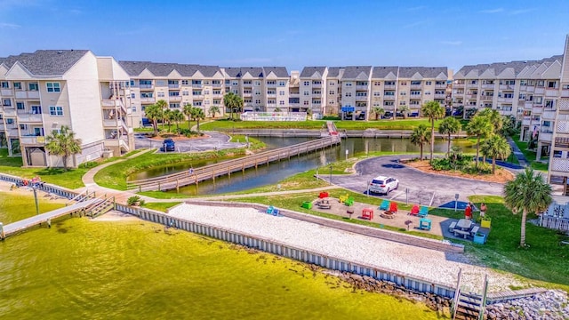 view of community with a water view