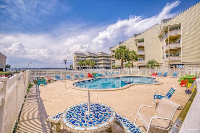 view of swimming pool with a patio