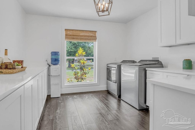 6050 Cheyenne Dr, Milton, FL 32570 - laundry room with cabinet space, separate washer and dryer, wood finished floors, and a chandelier