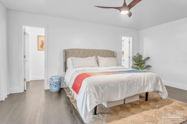 6050 Cheyenne Dr, Milton, FL 32570 - bedroom with wood finished floors, baseboards, and a ceiling fan