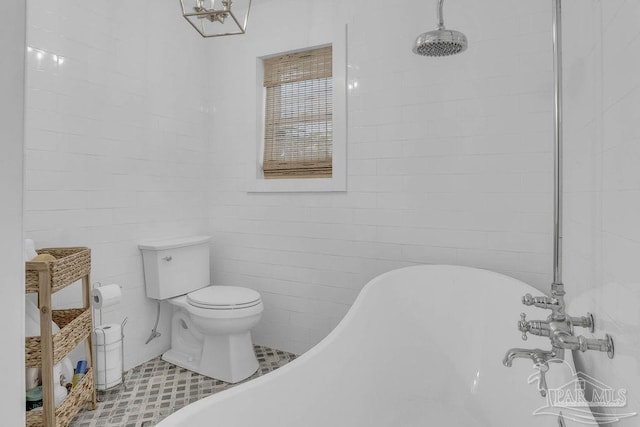 6050 Cheyenne Dr, Milton, FL 32570 - bathroom with a freestanding tub, toilet, a chandelier, and a tile shower