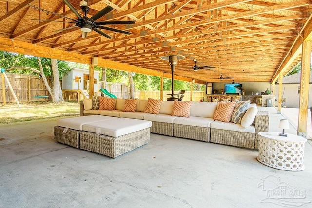 6050 Cheyenne Dr, Milton, FL 32570 - fenced backyard featuring an outdoor living space, a ceiling fan, and a patio area