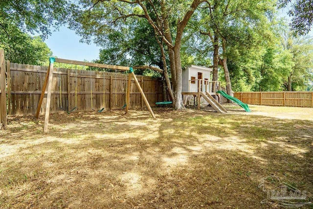 6050 Cheyenne Dr, Milton, FL 32570 - fenced backyard featuring a playground
