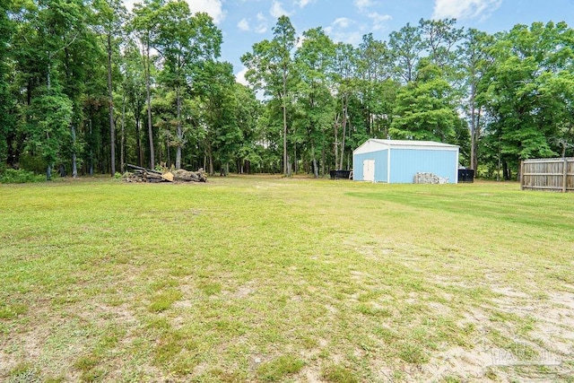 6050 Cheyenne Dr, Milton, FL 32570 - view of grassy yard with an outbuilding and an outdoor structure