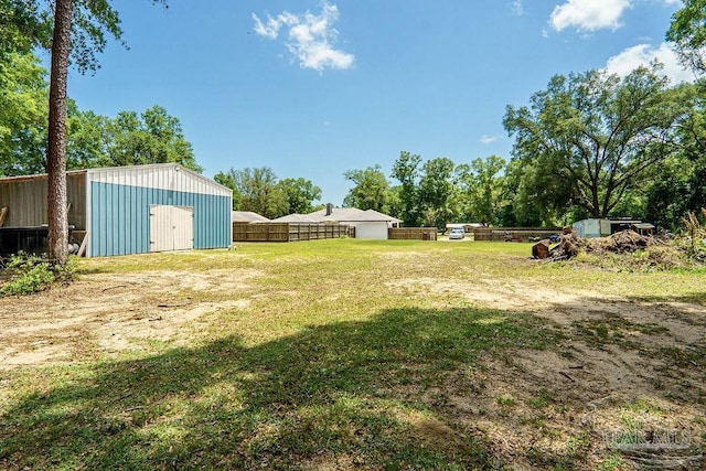 6050 Cheyenne Dr, Milton, FL 32570 - view of yard featuring a pole building and an outbuilding