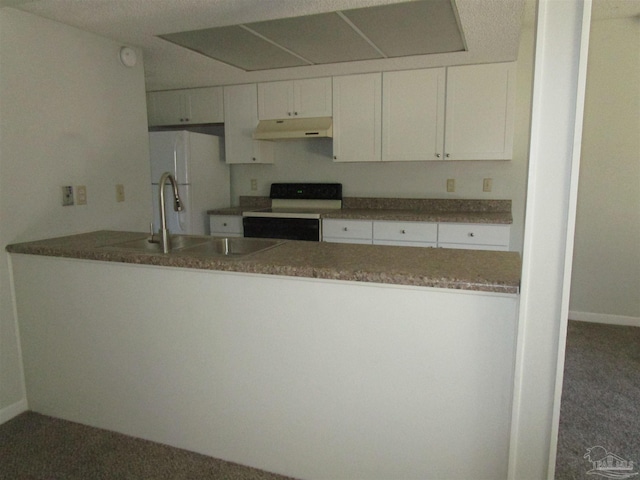 kitchen featuring white cabinets, sink, black range oven, and white fridge