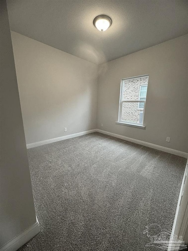 1636 Slate Dr, Cantonment, FL 32533 - carpeted empty room with baseboards and a textured ceiling