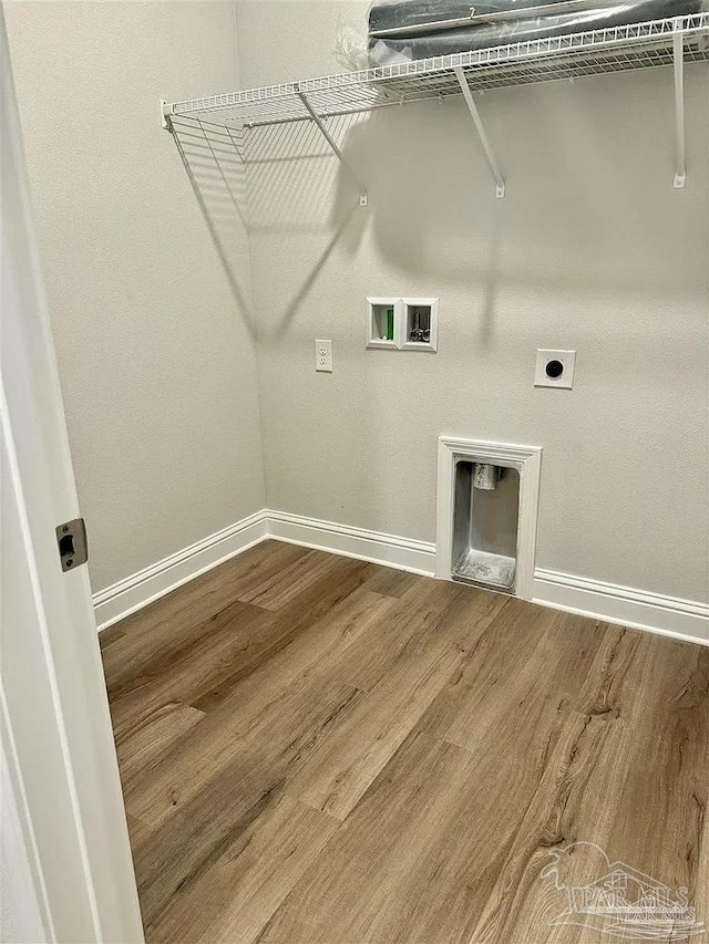 1636 Slate Dr, Cantonment, FL 32533 - laundry area with electric dryer hookup, washer hookup, wood finished floors, and baseboards